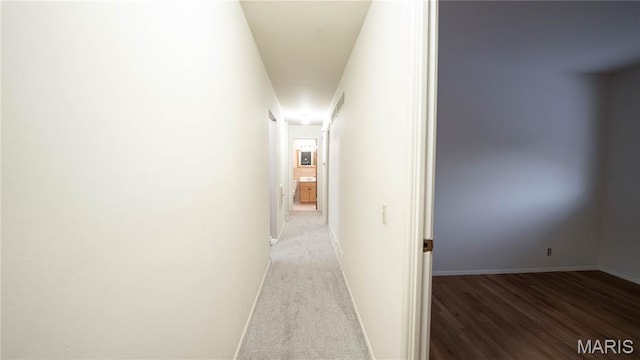 2480 Cambridge Dr, Florissant, MO 63033 - hallway with baseboards and wood finished floors