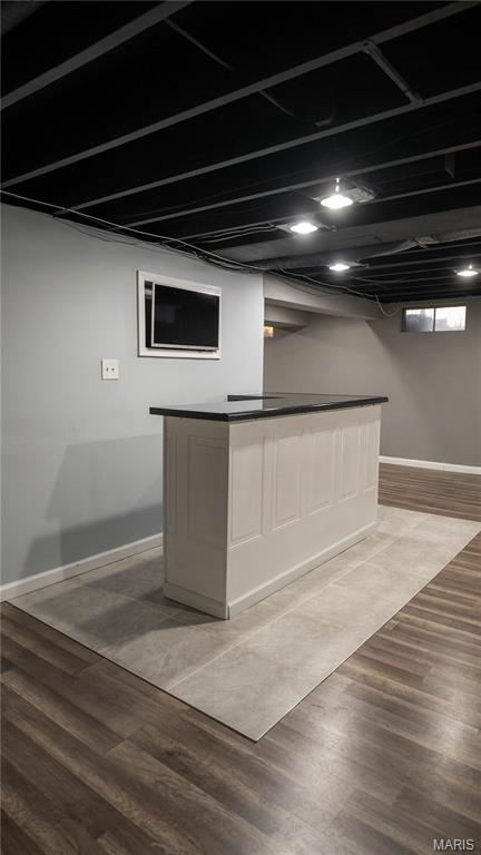 2480 Cambridge Dr, Florissant, MO 63033 - indoor dry bar with wood finished floors