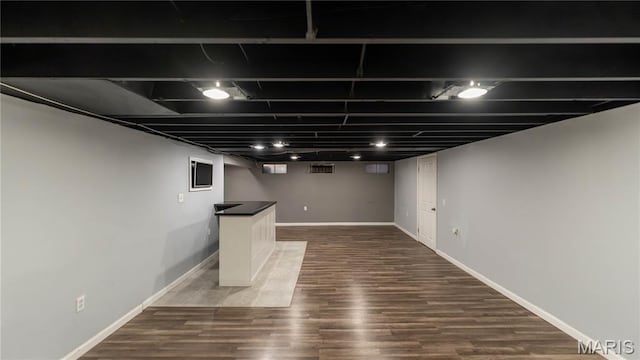 2480 Cambridge Dr, Florissant, MO 63033 - finished basement featuring dark wood-style flooring