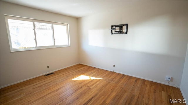 2480 Cambridge Dr, Florissant, MO 63033 - empty room with light wood-style floors and baseboards