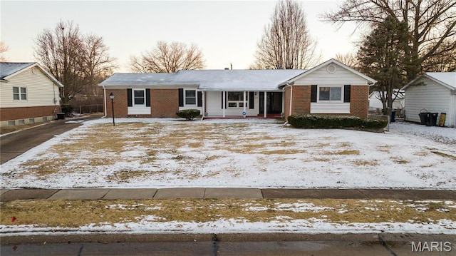 2480 Cambridge Dr, Florissant, MO 63033 - single story home featuring brick siding, driveway, and a porch
