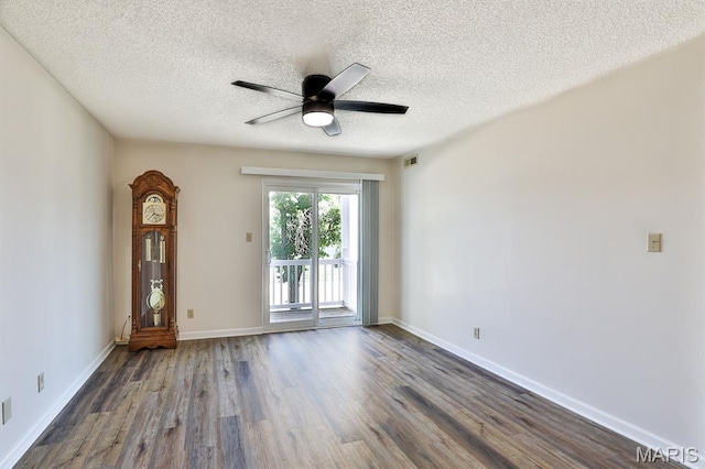 160 Jubilee Hill Dr Unit G, Grover, MO 63040 - spare room featuring dark wood-style flooring, ceiling fan, and a textured ceiling