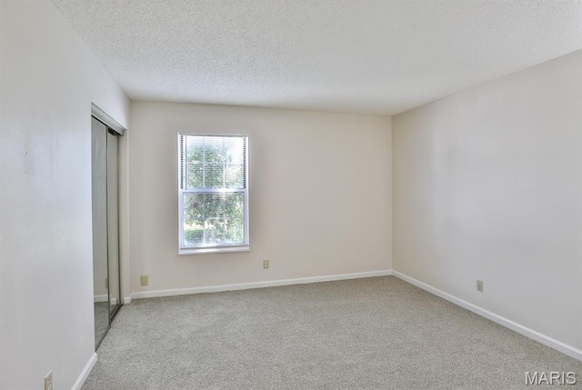 160 Jubilee Hill Dr Unit G, Grover, MO 63040 - spare room featuring carpet floors and a textured ceiling