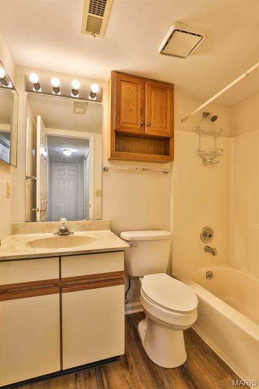 160 Jubilee Hill Dr Unit G, Grover, MO 63040 - full bath with wood finished floors, vanity, and tub / shower combination