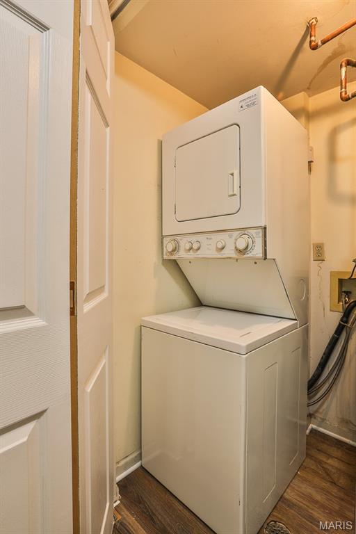 160 Jubilee Hill Dr Unit G, Grover, MO 63040 - laundry room with stacked washer and clothes dryer and dark wood-type flooring