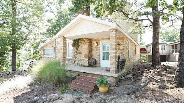 18937 Wayne Route D, Wappapello, MO 63966 - view of front of house with a chimney, covered porch, and stone siding