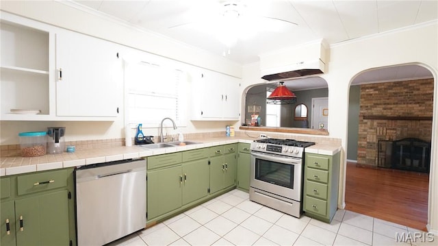 18937 Wayne Route D, Wappapello, MO 63966 - kitchen featuring appliances with stainless steel finishes, crown molding, open shelves, a ceiling fan, and light tile patterned floors