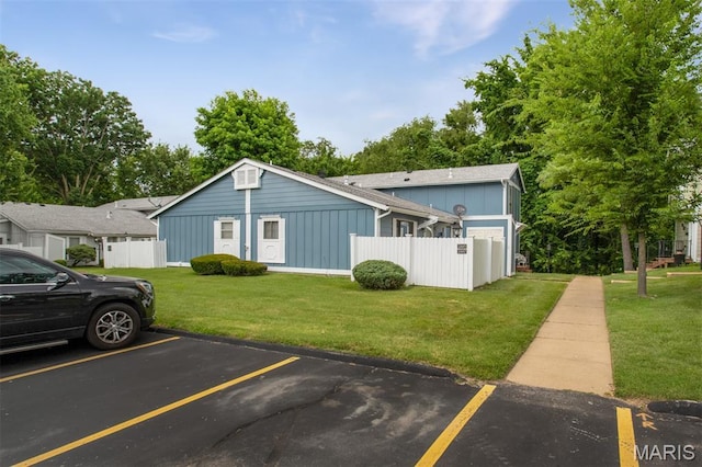 2449 Forest Shadows Dr, Saint Louis, MO 63136 - view of front of house with board and batten siding and uncovered parking