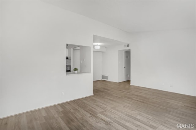 2449 Forest Shadows Dr, Saint Louis, MO 63136 - unfurnished living room with wood finished floors