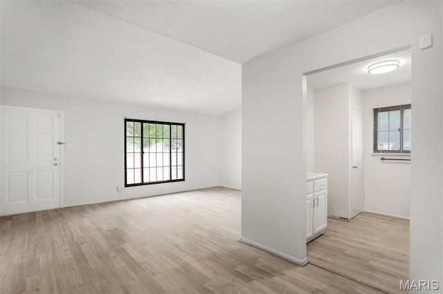 2449 Forest Shadows Dr, Saint Louis, MO 63136 - empty room featuring light wood-style flooring and baseboards