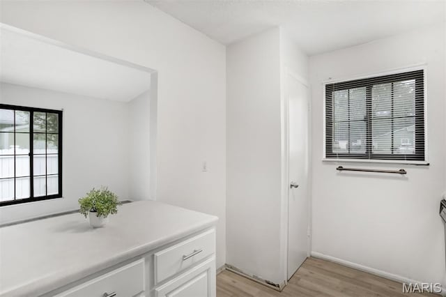 2449 Forest Shadows Dr, Saint Louis, MO 63136 - bathroom featuring wood finished floors and baseboards
