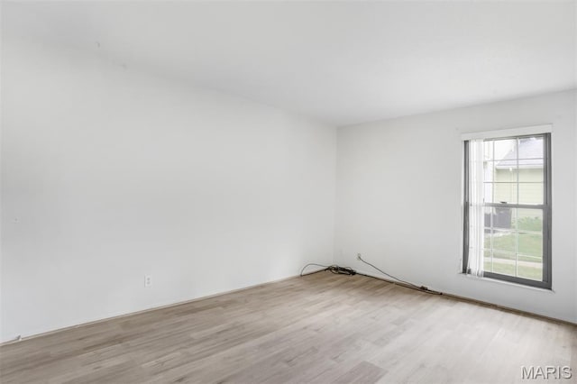 2449 Forest Shadows Dr, Saint Louis, MO 63136 - unfurnished room featuring wood finished floors