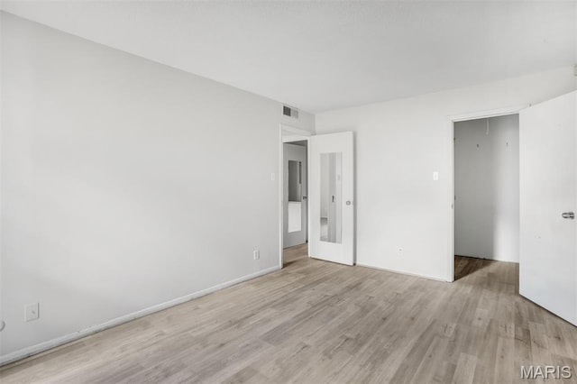 2449 Forest Shadows Dr, Saint Louis, MO 63136 - unfurnished bedroom featuring light wood-style floors