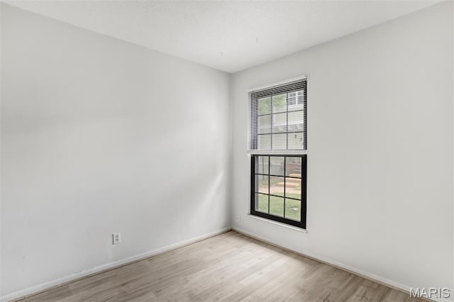 2449 Forest Shadows Dr, Saint Louis, MO 63136 - empty room featuring light wood-style flooring and baseboards