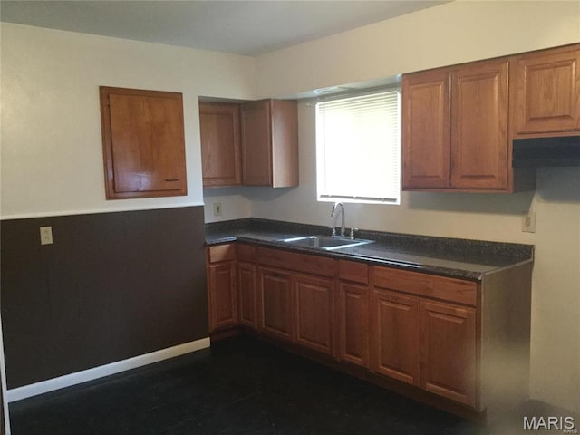 8552 Church Rd, Saint Louis, MO 63147 - kitchen featuring dark countertops and brown cabinetry
