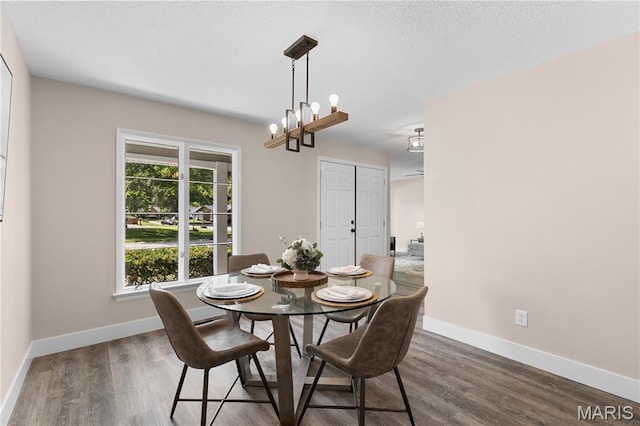 1618 Clock Tower Dr, Saint Louis, MO 63138 - dining room featuring dark wood-type flooring and a chandelier