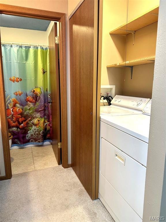 40 Robinwood Unit 2C, Lake Ozark, MO 65049 - laundry room with hookup for a washing machine and light carpet