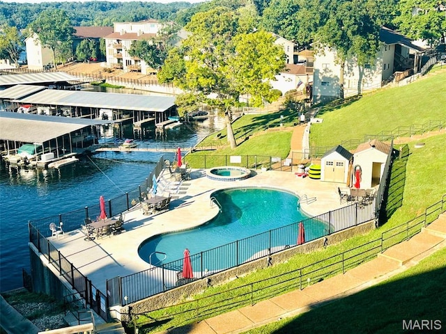 40 Robinwood Unit 2C, Lake Ozark, MO 65049 - community pool featuring a hot tub, a patio, and a water view