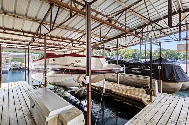 40 Robinwood Unit 2C, Lake Ozark, MO 65049 - dock featuring boat lift and a water view