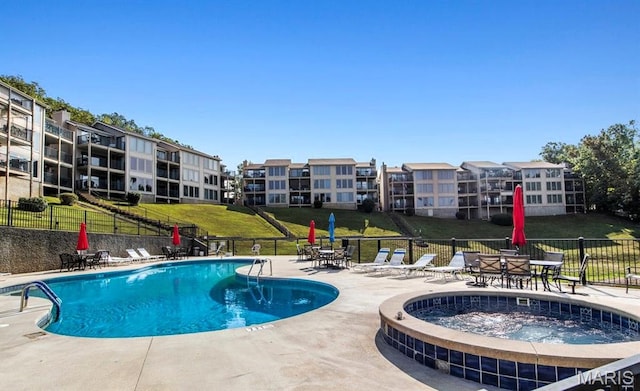 40 Robinwood Unit 2C, Lake Ozark, MO 65049 - community pool featuring a hot tub and a patio