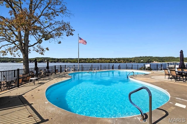 40 Robinwood Unit 2C, Lake Ozark, MO 65049 - community pool featuring a patio area and a water view