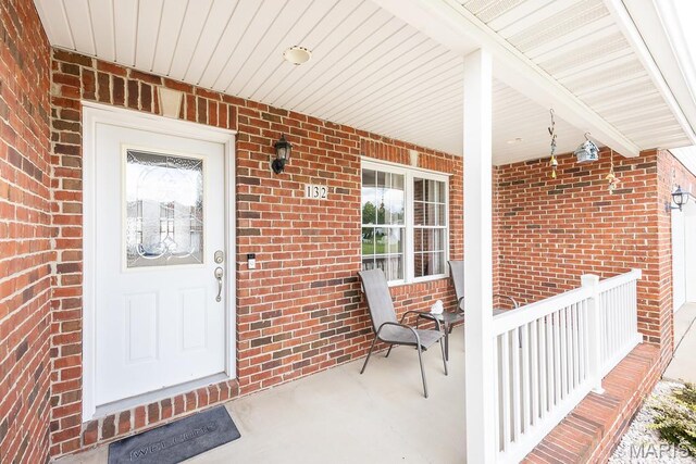 132 Timberlake, Damiansville, IL 62215 - doorway to property with a porch and brick siding