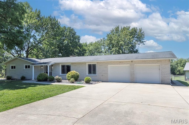 5 Lakeshore Dr, New Baden, IL 62265 - ranch-style house with a garage, brick siding, driveway, and a front yard
