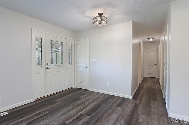 5 Lakeshore Dr, New Baden, IL 62265 - foyer entrance featuring dark wood finished floors and a textured ceiling