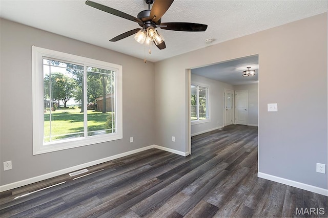 5 Lakeshore Dr, New Baden, IL 62265 - unfurnished room with dark wood finished floors, a ceiling fan, a textured ceiling, and a smoke detector