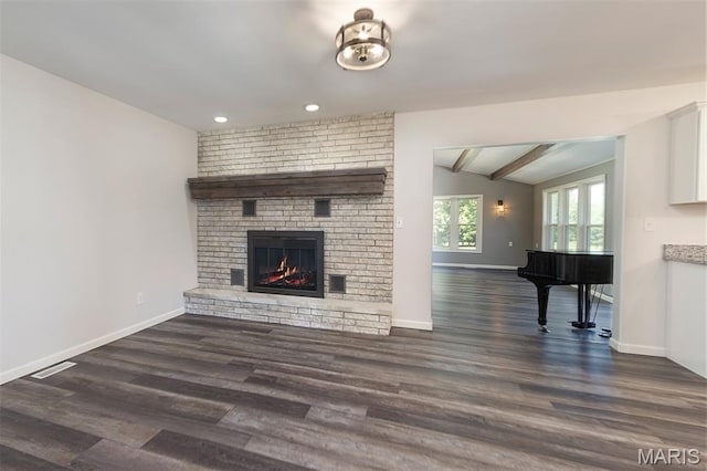 5 Lakeshore Dr, New Baden, IL 62265 - unfurnished living room featuring dark wood-style flooring, a brick fireplace, and recessed lighting