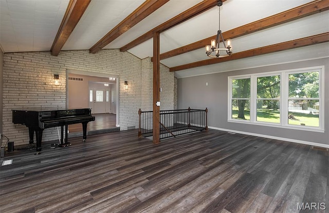 5 Lakeshore Dr, New Baden, IL 62265 - unfurnished living room featuring dark wood-style floors, a chandelier, and brick wall