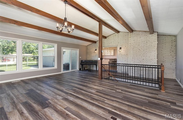 5 Lakeshore Dr, New Baden, IL 62265 - unfurnished living room featuring brick wall, a chandelier, and wood finished floors