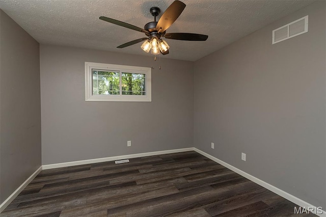 5 Lakeshore Dr, New Baden, IL 62265 - spare room with dark wood-style flooring, a textured ceiling, and ceiling fan