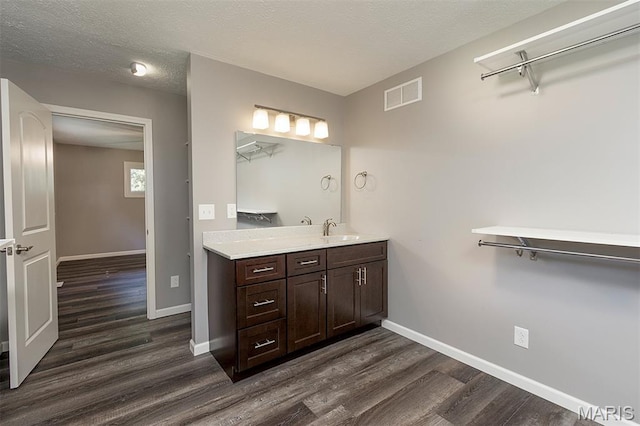 5 Lakeshore Dr, New Baden, IL 62265 - bathroom with wood finished floors, vanity, and a textured ceiling
