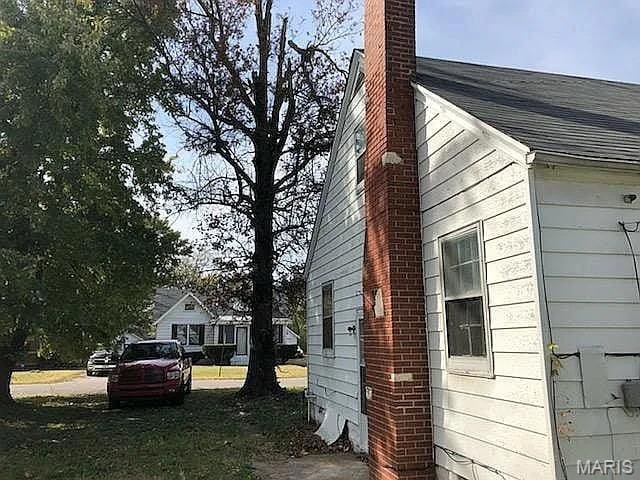 419 Garrison Ave, Cahokia, IL 62206 - view of side of home with a chimney