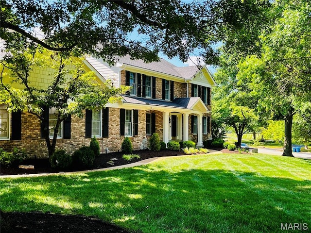 2032 Wilson Ridge Ln, Chesterfield, MO 63005 - view of front facade featuring a front lawn and brick siding