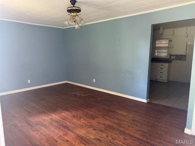 935 Pershing St, Poplar Bluff, MO 63901 - empty room with ornamental molding, dark wood-style flooring, and a ceiling fan
