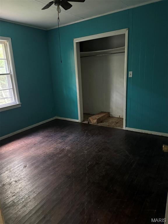 935 Pershing St, Poplar Bluff, MO 63901 - unfurnished bedroom with wood finished floors, crown molding, a closet, and ceiling fan