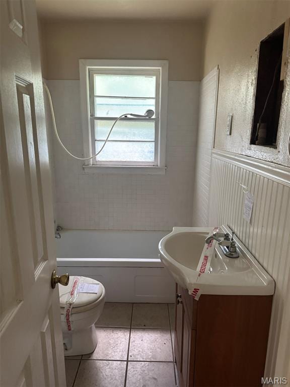 935 Pershing St, Poplar Bluff, MO 63901 - bathroom featuring vanity, tile patterned floors, washtub / shower combination, and wainscoting