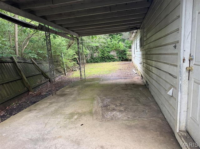 935 Pershing St, Poplar Bluff, MO 63901 - fenced backyard with a carport and a patio