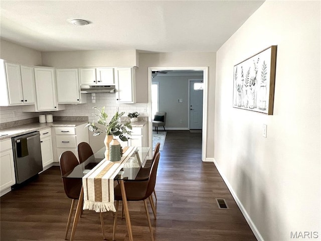 218 Mill St, Bethalto, IL 62010 - kitchen with stainless steel dishwasher, decorative backsplash, white cabinetry, and dark wood finished floors