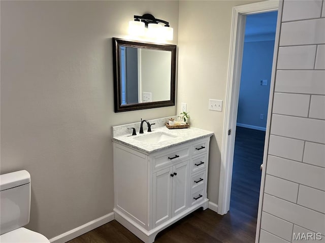 218 Mill St, Bethalto, IL 62010 - half bathroom featuring wood finished floors and vanity