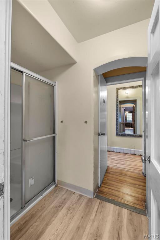 325 N Spring St, Cape Girardeau, MO 63701 - bathroom featuring wood finished floors and a shower with shower door