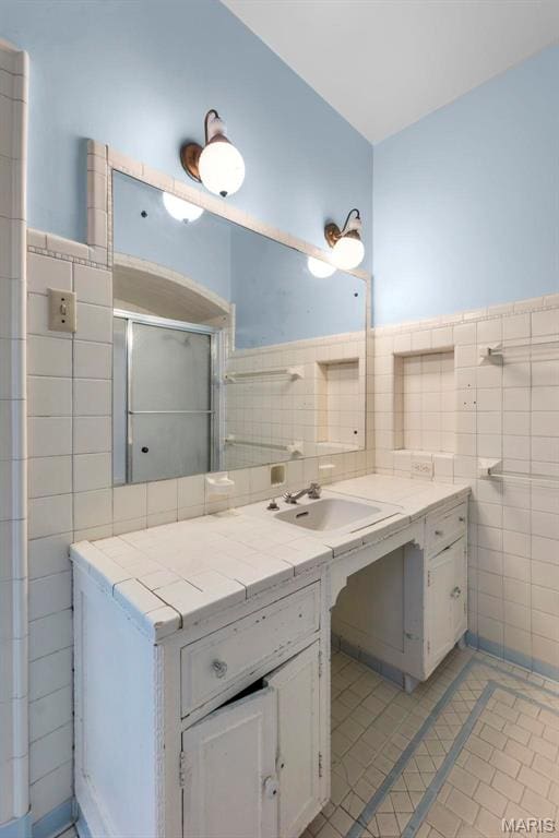 325 N Spring St, Cape Girardeau, MO 63701 - bathroom with tile walls, vanity, tile patterned flooring, and wainscoting