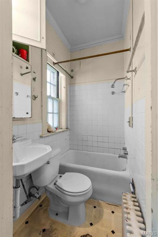 325 N Spring St, Cape Girardeau, MO 63701 - bathroom with tile walls, ornamental molding, radiator, and tub / shower combination