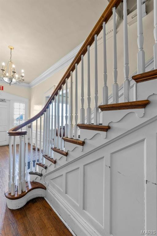 325 N Spring St, Cape Girardeau, MO 63701 - staircase with a chandelier, ornamental molding, and wood finished floors