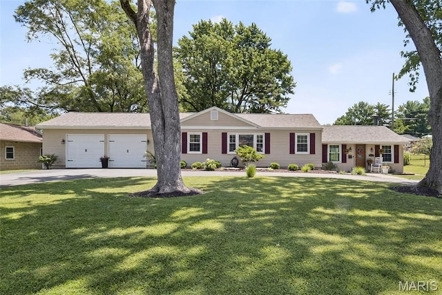 3432 Adie Rd, Saint Ann, MO 63074 - ranch-style house with an attached garage, concrete driveway, and a front lawn