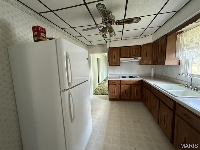 1220 W Edwards St, Vandalia, IL 62471 - kitchen with white appliances, wallpapered walls, light flooring, a paneled ceiling, and a ceiling fan