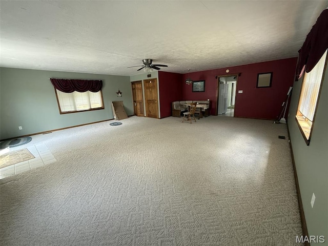 1220 W Edwards St, Vandalia, IL 62471 - unfurnished living room featuring ceiling fan and carpet flooring