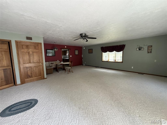 1220 W Edwards St, Vandalia, IL 62471 - living area featuring ceiling fan, light carpet, and a textured ceiling